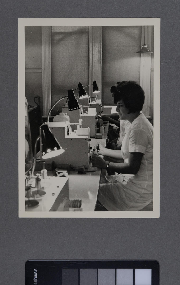 [Hirst Contact Lens laboratory technician at work station] Museum of