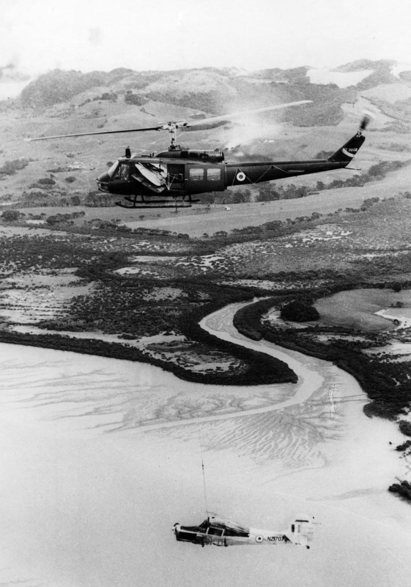 RNZAF Iroquois helicopter carrying Auster after it crashed in Kaipara