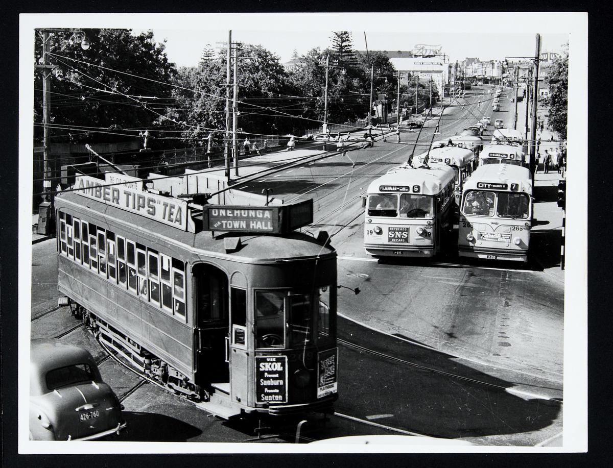 [Tram 209 turning in front of rows of buses and trolley buses] Museum